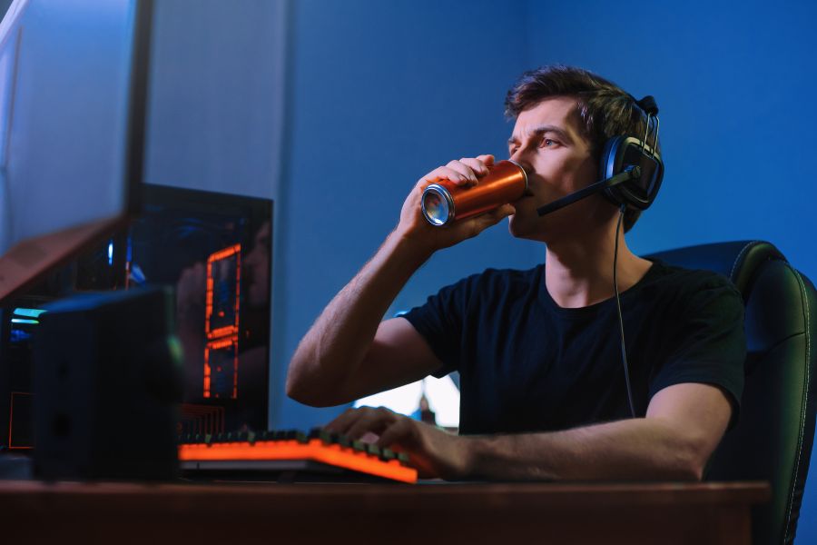 A man drinking an energy drink